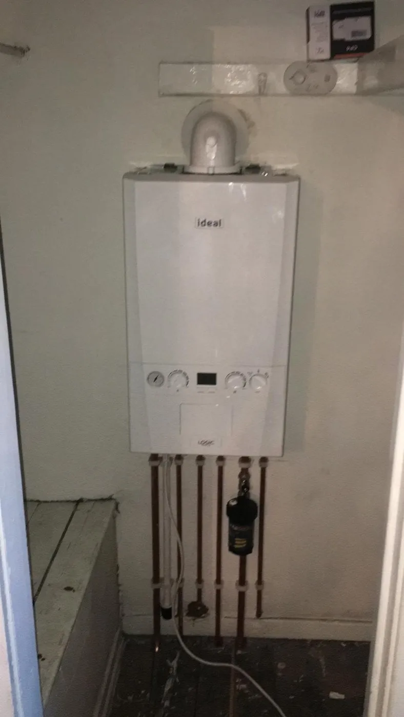 A newly fitted Ideal boiler with neat copper pipework underneath